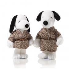 Two black and white dog statues in front of a white background. They are wearing long, cheetah print outfits with a brown belt.