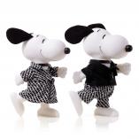Two black and white dog statues in front of a white background. They are walking  and wearing black and white outfits.