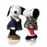 Two black and white dog statues in front of a white background. The dog on the left is wearing a jean jacket and black pants. The dog on the right is wearing red pants, black high heels and fur jacket.