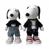 Two black and white dog statues in front of a white background. They are wearing denim pants and converse shoes.