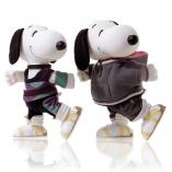 Two black and white dog statues in front of a white background. They are walking and wearing fluffy sweaters with white and yellow shoes.
